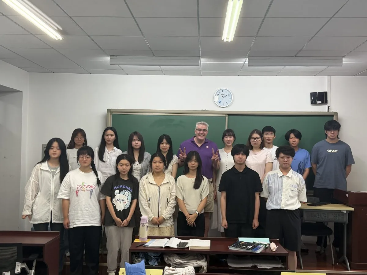 James Foster and summer camp participants gathered for a Class 3 group photograph at CUEB.